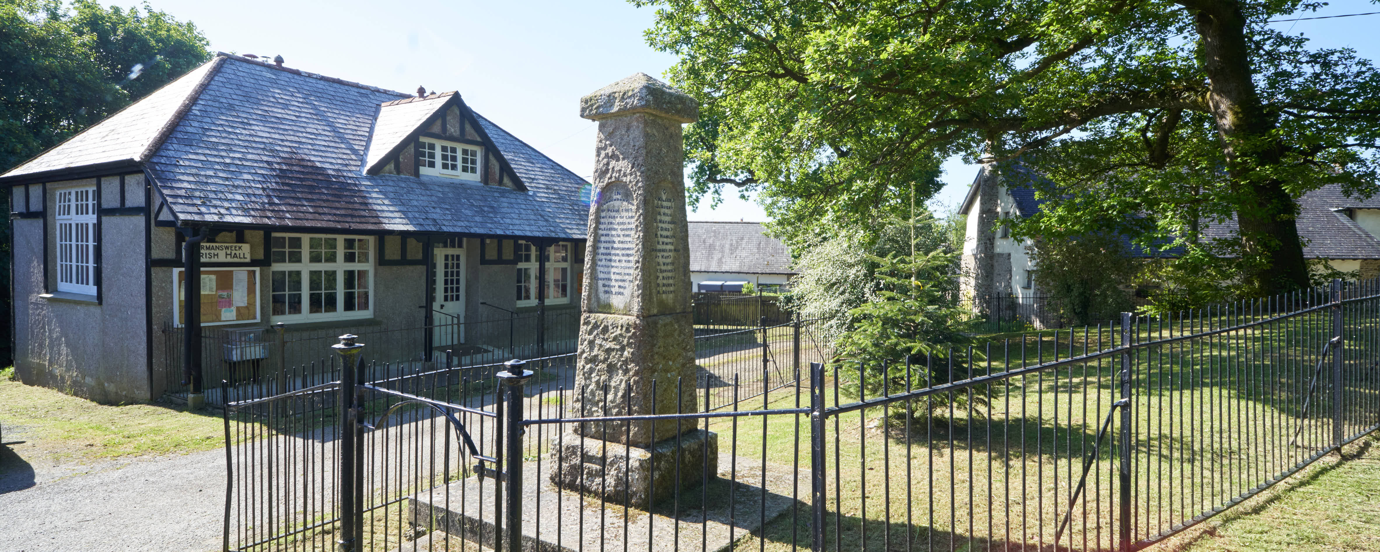 Photo of Village hall and war memorial in foreground